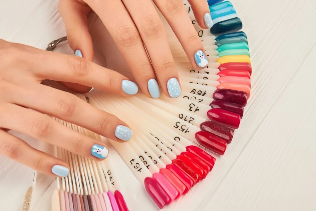 manicured hands and collection of nail samples